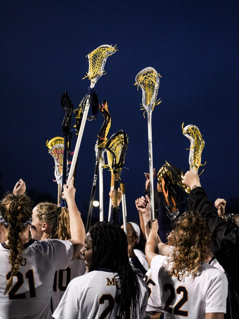 Girl's lacrosse team celebrates a win