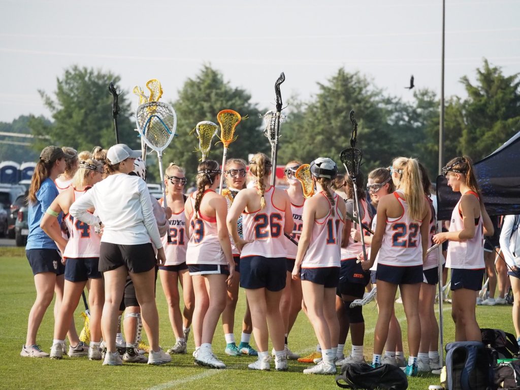 High school club lacrosse team preparing to play at summer tournament Champion's Cup.